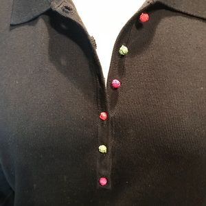 A cheery black cotton, Lycra, spandex sweater.